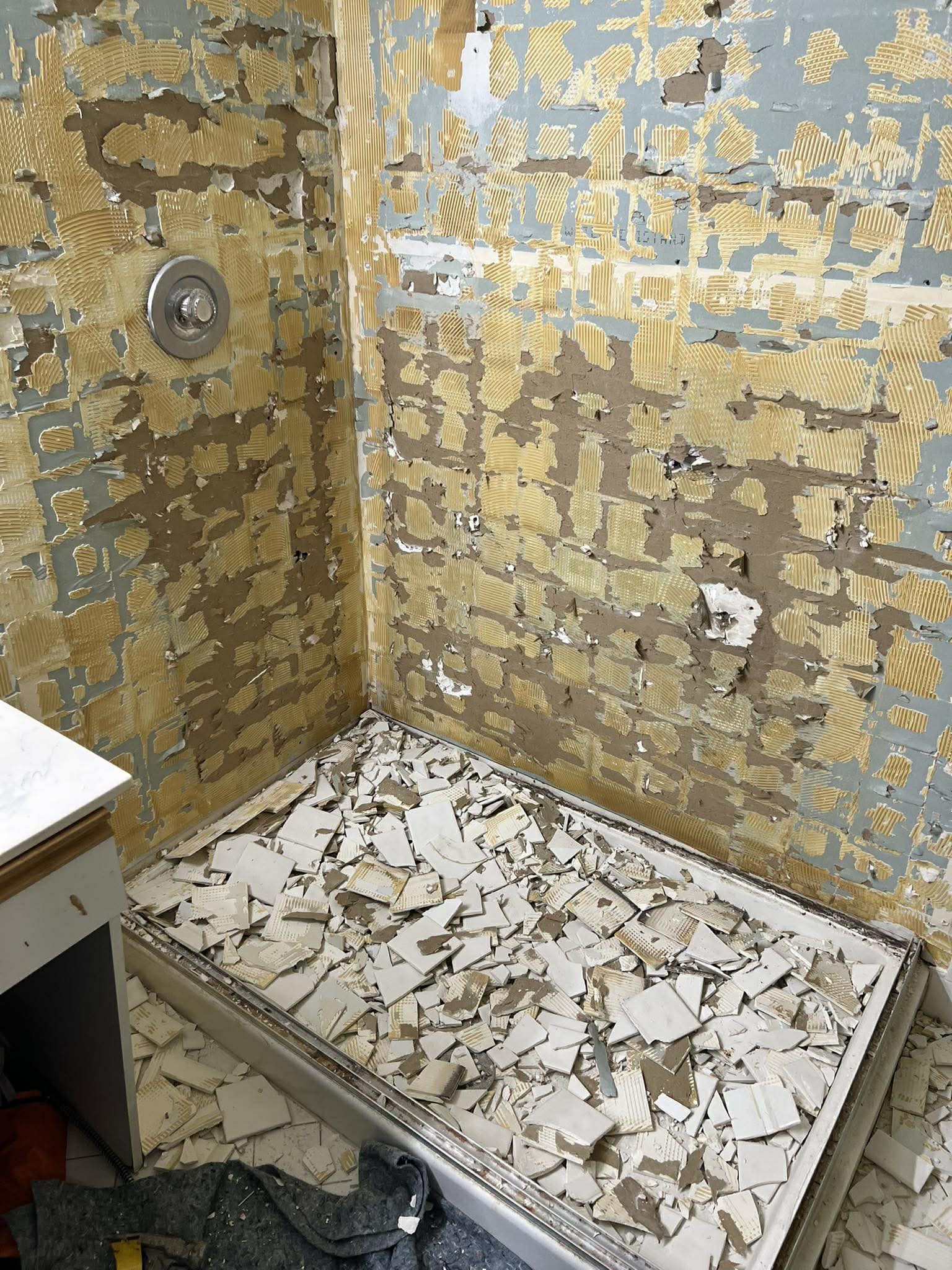 Step 2: Demolition and tile removal during bathroom remodel by Custom Bath and Tile