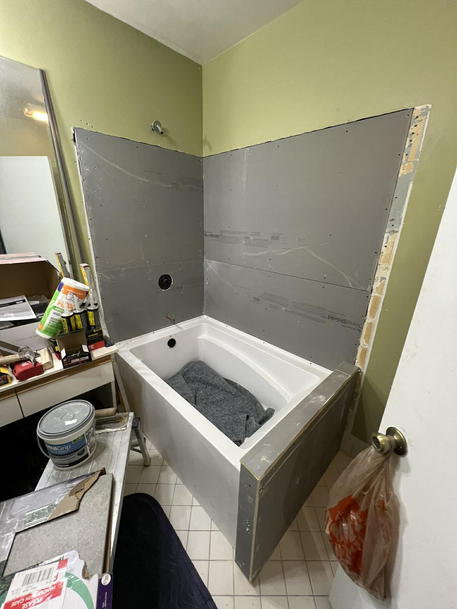 Step 3: Waterproof backer board and moisture barrier installation during bathroom remodel by Custom Bath and Tile